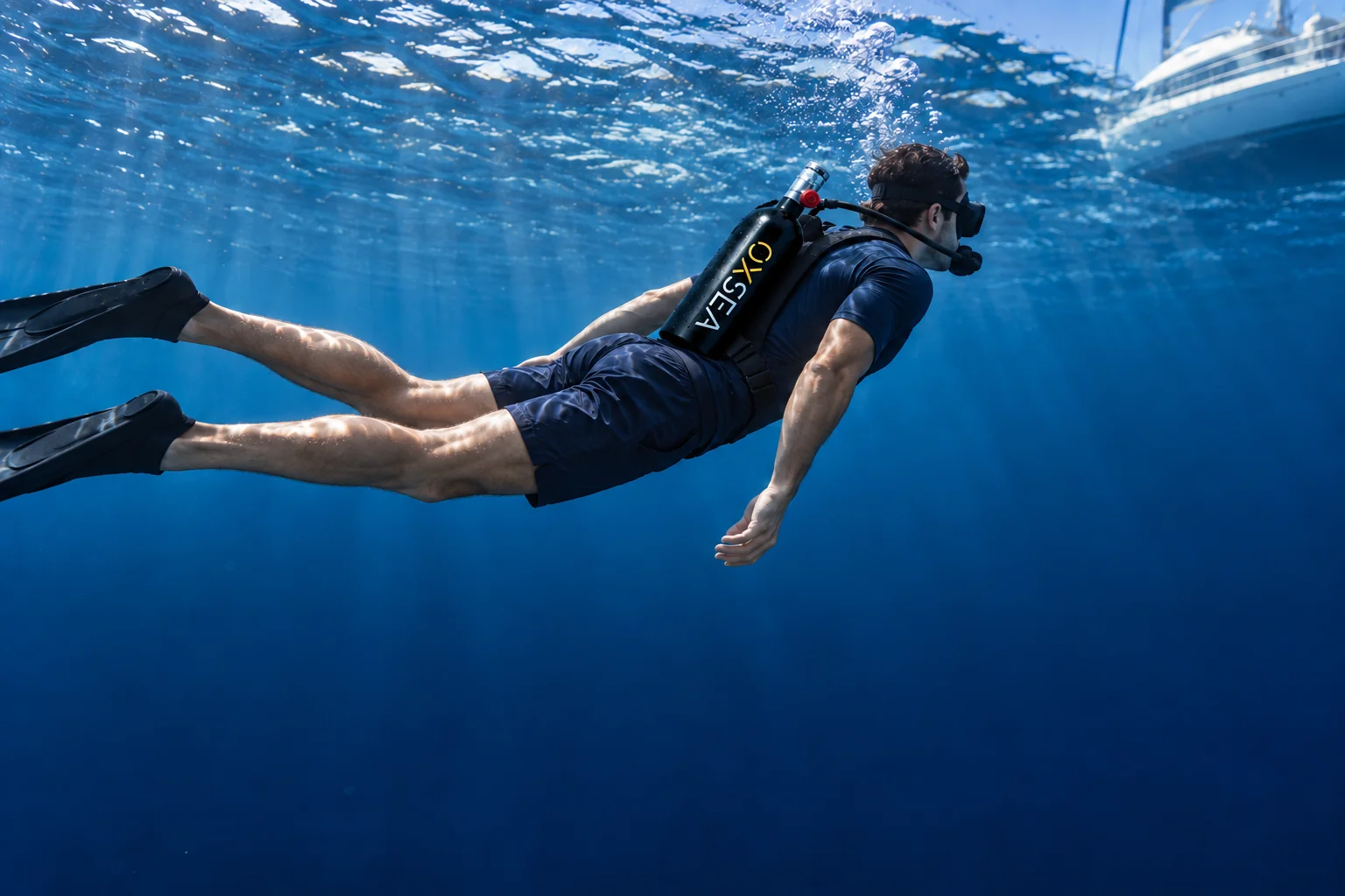 A dive with an OX1000 worn on the back in its harness, connected to the regulator in the mouth.